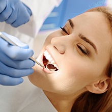 Woman receiving dental exam