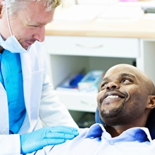 Smiling man in dental chair