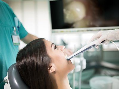 Dentist and patient looking at intraoral photos