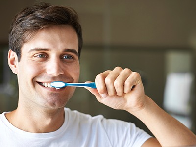 Man brushing teeth