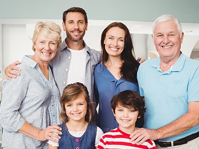 Three generations of family smiling together