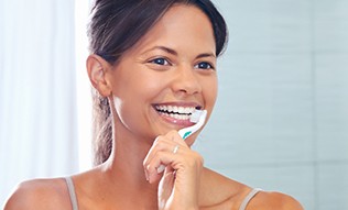 Woman brushing teeth