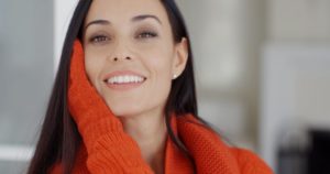 smiling woman in sweater