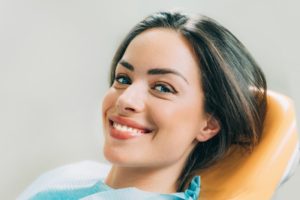 Woman smiling in dentist’s chair